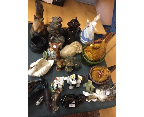 A QUANTITY OF CERAMIC ANIMALS TO INCLUDE HEN CROCKS, OWLS, COWS, PIGS, A POOLE DOLPHIN, ETC 