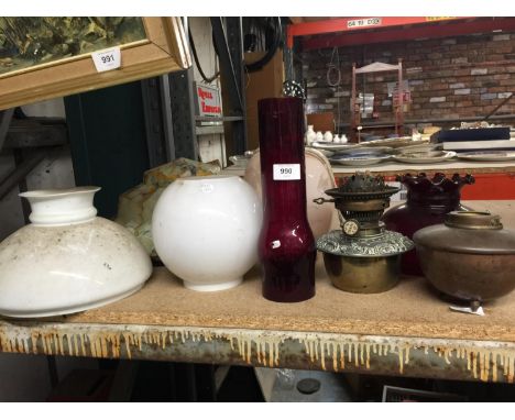 THREE VINTAGE GLASS LAMPSHADES, A HINK'S N0. 2 LEVER OIL LAMP WITH CRANBERRY GLASS CHIMNEY AND SHADE PLUS A TABLE LAMP 