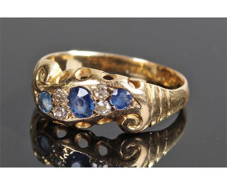 18 carat gold sapphire and diamond ring, with three sapphires and four diamonds to the head, ring size K