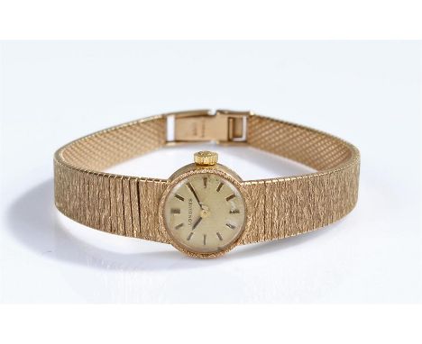 Longines 9 carat gold ladies wristwatch, the signed champagne dial with baton hours, manual wound, with a 9 carat gold bracel