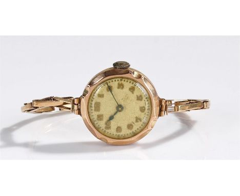 9 carat gold ladies wristwatch, the champagne dial with Arabic hours, manual wound, 9 carat gold strap, case 25mm diameter 