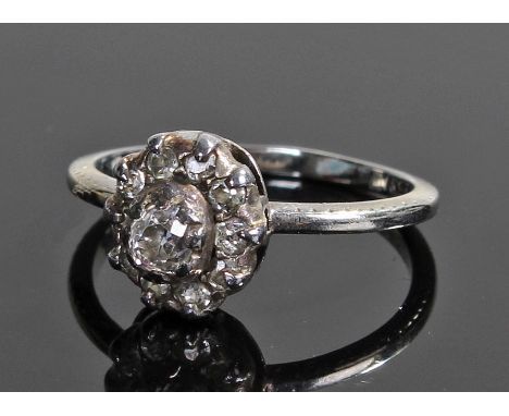 18 carat white gold and diamond ring, the diamonds set to form a flower head, ring size K