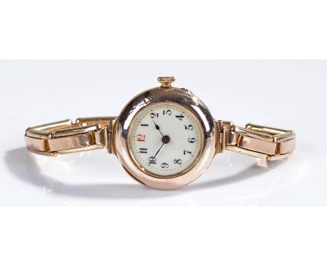 9 carat gold wristwatch, the white enamel dial with Arabic hours and a 9 carat gold strap, case 28mm diameter 