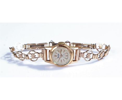Mudu ladies 18 carat gold wristwatch, the signed silvered dial with baton hours, manual wound, with a 9 carat gold bracelet s