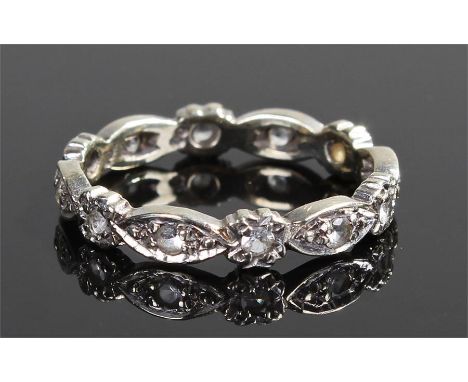 9 carat gold diamond set eternity ring, of flower and naiveté form, ring size R