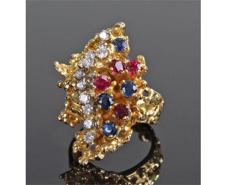 18 carat gold diamond ruby and sapphire ring, the ring with a stylised head and trailing rows of diamonds, rubies and sapphir