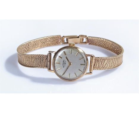 Rotary ladies 9 carat gold wristwatch, the signed silvered dial with gilt baton hours, manual wound, with a bark effect 9 car