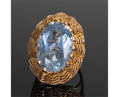 Gold ring, with a pale blue stone with facetted edges, ring size K