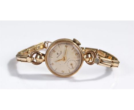 Rolex Precision ladies 9 carat gold wristwatch, the signed champagne dial with arrow and Arabic hour markers, subsidiary seco
