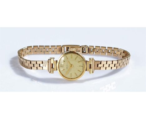 Zenith 18 carat gold ladies wristwatch, the signed silvered dial with baton hours, manual wound, with a 9 carat gold bracelet