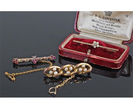 Three brooches, to include a ruby and diamond example, a pearl example and a further pearl example, (3)