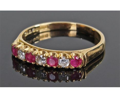 18 carat gold diamond and ruby ring, set with three diamonds and four rubies, ring size T