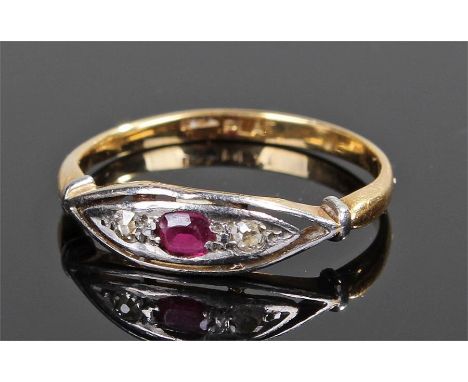 18 carat gold diamond and ruby ring, with a central ruby flanked by a pair of diamonds, ring size R