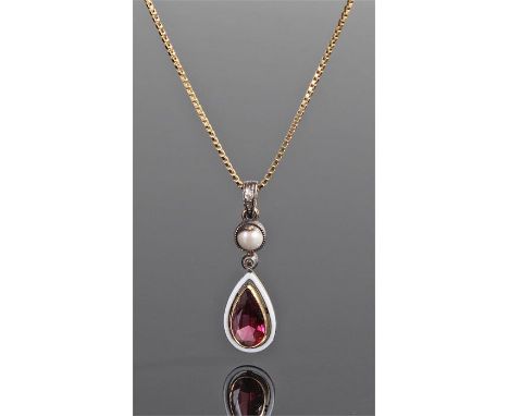 Diamond, pearl and garnet pendant, in tear drop form with a white enamel edge attached to a 9 carat gold chain