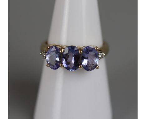 Gold tanzanite &amp; diamond set ring - Approx size: N 