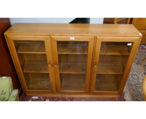 Ercol blonde elm glazed bookcase 
