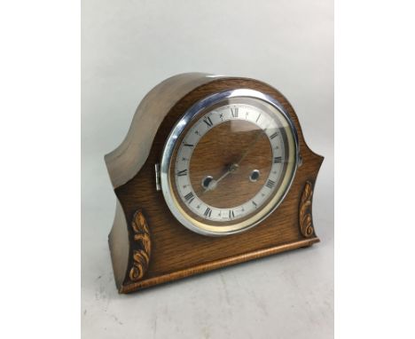 OAK CASED MANTEL CLOCK, 23cm high, along with brass candlesticks, two brass desk weights and a pair of brass vases (7)