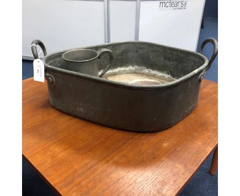 AN EARLY 19TH CENTURY COPPER BASIN, 55cm wide, along with a pewter mug and a plated copper circular dish (3)