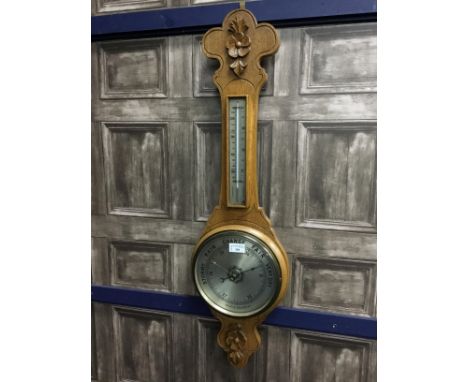BAROMETER WITH THERMOMETER, in an oak case, 87cm high