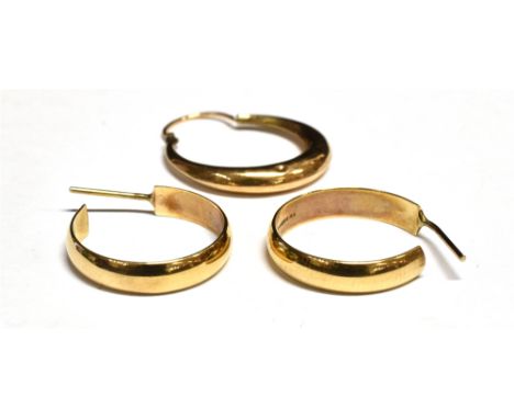 A PAIR OF VINTAGE 9CT GOLD THREE-QUARTER HOOP EARRINGS London 1969; another single hoop earring, the three 4g gross 