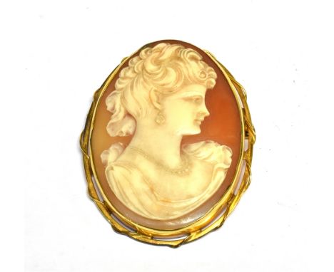 A VINTAGE SHELL CAMEO OVAL BROOCH, DEPICTING AN UNKNOWN FEMALE PROFILE wearing a pearl two-row necklace, rub-over set within 
