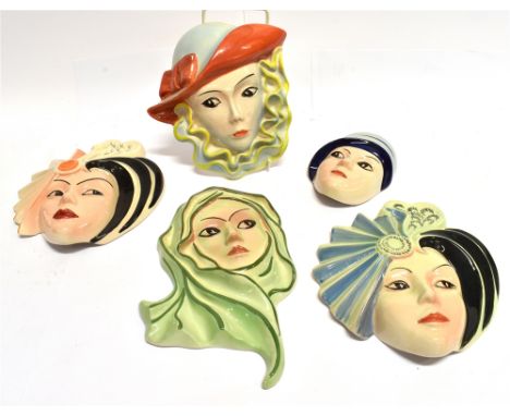 A GROUP OF CROWN DEVON ART DECO WALL MASKS  inscribed to reverse 'painted by Dorothy Ann'