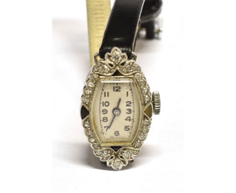 AN ART DECO LADY'S BLACK-ONYX AND DIAMOND TONNEAU-SHAPED WRIST WATCH, CIRCA 1930 the silvered dial with black painted Arabic 