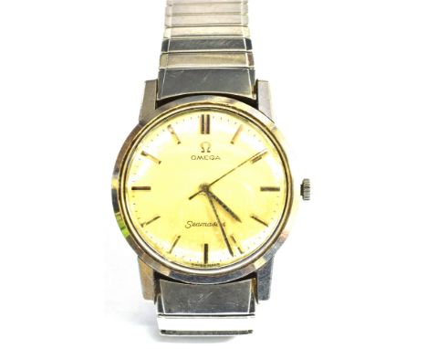 OMEGA, SEAMASTER, A GENTLEMAN'S STAINLESS STEEL BRACELET WATCH brushed light-cream dial with raised baton numerals and hands 
