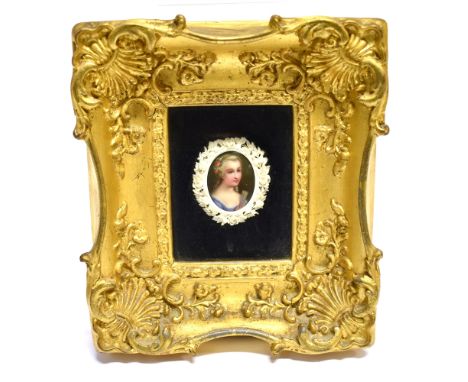 CONTINENTAL SCHOOL (19TH CENTURY)  Portrait miniature of a young lady,  oil on plaque, with a decorative floral and foliate s