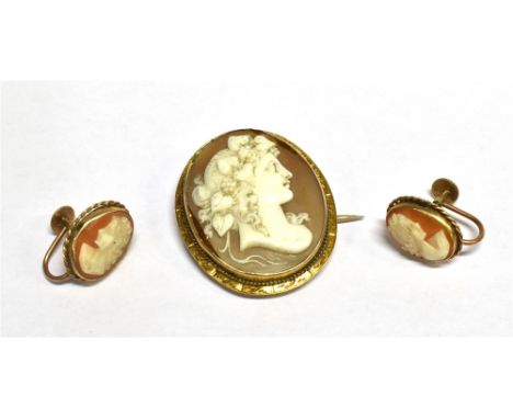 A VINTAGE SHELL CAMEO OVAL BROOCH DEPICTING 'FLORA' facing right, rub-over set within a rope twist and engraved frame, the ca