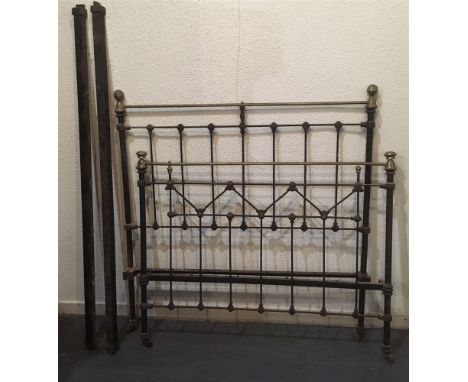 TWO EDWARDIAN METAL DOUBLE BEDSTEADS:  an Art Nouveau style brass bed and another iron framed, both approximately 140cm wide,