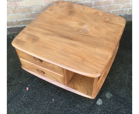 AN ERCOL LIGHT ELM 'PANDORAS BOX'  fitted with two drawers, on casters, 80cm square 40cm high