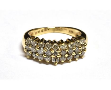 A 9CT GOLD AND SMALL DIAMOND THREE ROW RING the 27 small round brilliant approx. 0.99cts total, all claw set to a tapering sh