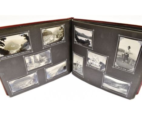 A PHOTOGRAPH ALBUM  circa 1951-55, comprising approximately 180 black and white snapshots of topographical, portrait and othe