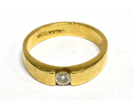 A VINTAGE 18CT GOLD AND DIAMOND SOLITAIRE RING compression set with a small round brilliant diamond approx. 0.15cts, to a squ