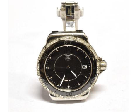 TAG HEUER MID, A MID-SIZE STAINLESS STEEL AND DIAMOND BRACELET WATCH Ref WAH1212 RKV5440, black dial with raised baton numera