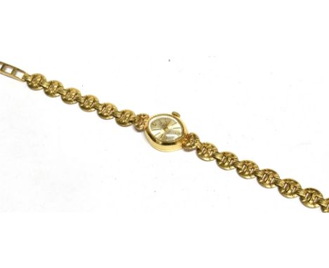 AVIA, A LADY'S 9CT GOLD OVAL BRACELET WATCH, CIRCA 1990 the silvered dial with raised gilt 12 and baton numerals and hands, t
