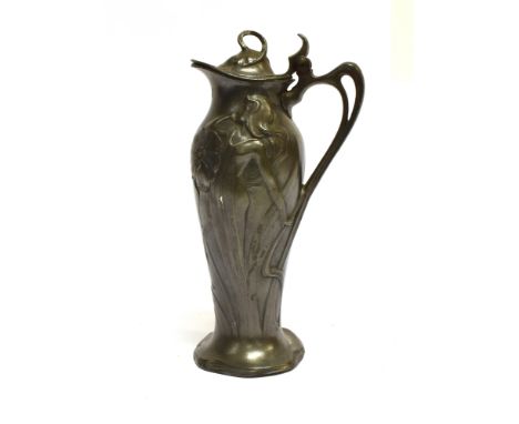 A WMF ART NOUVEAU LIDDED JUG  relief moulded with semi-clad female and foliate designs, whiplash handle, impressed marks to b