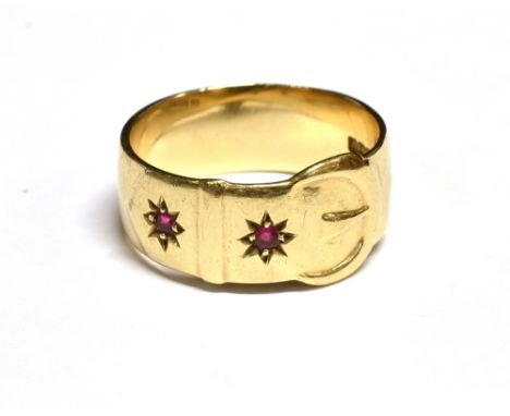 A VINTAGE 9CT GOLD 'BUCKLE' RING star-gypsy set with two small round synthetic rubies, Birmingham 1969, 8mm wide, size leadin