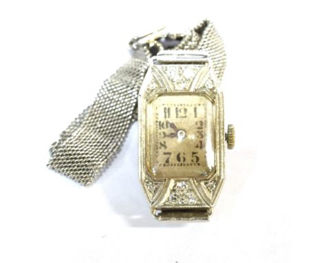 RECTA, AN ART DECO LADY'S DIAMOND CANTED-RECTANGULAR BRACELET WATCH Silvered dial with black painted Arabic numerals and hand