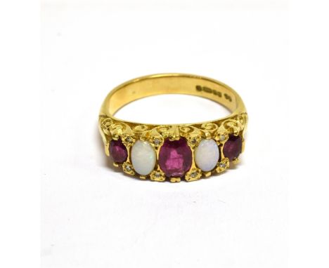 A VINTAGE 18CT GOLD, RUBY, OPAL AND DIAMOND CARVED HALF-HOOP RING IN VICTORIAN STYLE the three graduated oval mixed-cut rubie