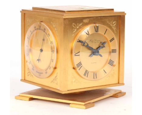 A MODERN FRENCH GILT BRASS CLOCK HYGROMETER BAROMETER AND THERMOMETER with quartz movement on square rotating base 13 cm high