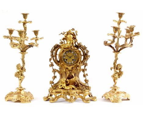 HENRY MARC, PARIS, A FRENCH 19th CENTURY ORMOLU THREE PIECE CLOCK GARNITURE the case surmounted by a seated cherub above a re