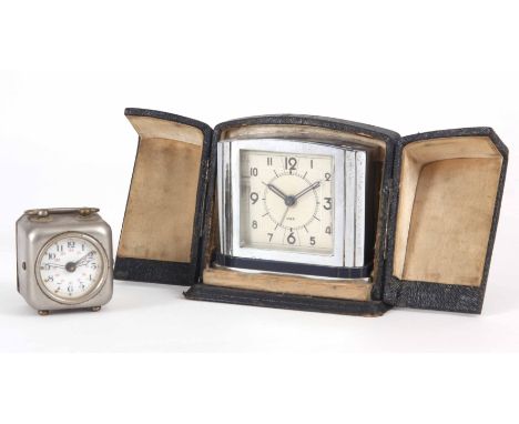 TWO TRAVEL CLOCKS one art deco style in a case 9cm high the other nickel plated with enamel dial 5cm high