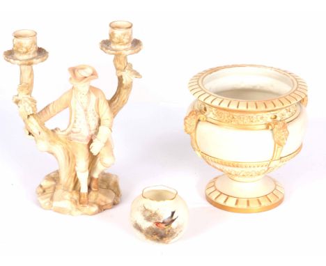 THREE ITEMS OF ROYAL WORCESTER BLUSH IVORY PORCELAIN, a two-branch candelabra figure of a gentleman 25.5cm high, a vase with 