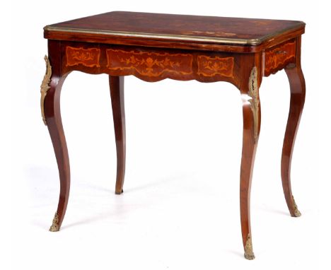 A 19TH CENTURY STYLE FRENCH MARQUETRY INLAID WALNUT GAMES TABLE with swivelling brass bound hinged top revealing a blue baize