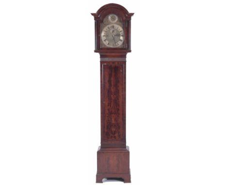 MAPLE &amp; CO, LONDON, AN EARLY 20TH CENTURY QUARTER CHIMING LONGCASE CLOCK with mahognay arched top case, the flamed mahoga