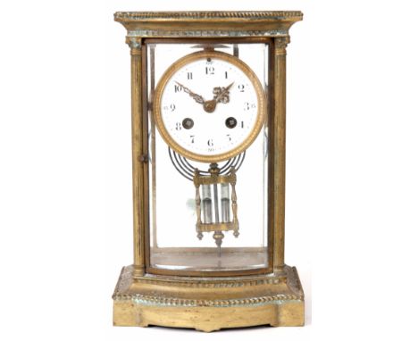 A LATE 19th CENTURY FRENCH FOUR GLASS MANTEL CLOCK the brass bow fronted case with reeded Corinthian columns framing four bev