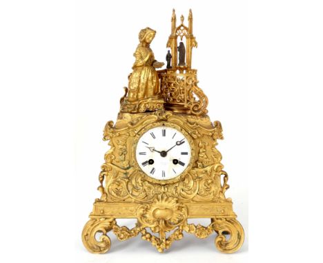 A LATE 19th CENTURY FRENCH FIGURAL ORMOLU MANTEL CLOCK the rococo style case with a praying lady to pediment enclosing a 3" p