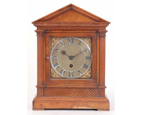 A LATE 19th CENTURY WALNUT ARCHITECTURAL CASED BRACKET CLOCK, HAVING A 6" SQUARE DIAL WITH A PIERCED SILVERED DIAL, FRONTING 